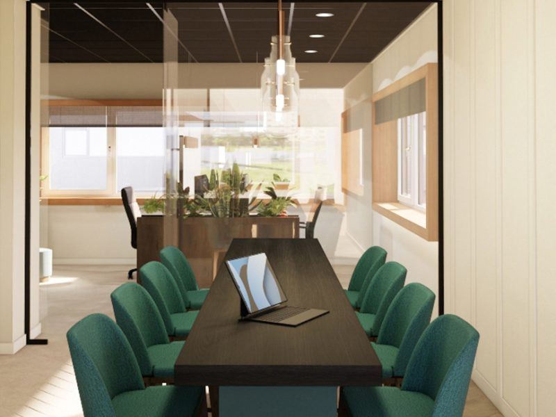 “Interieur van kantoorruimte in bouwunit met meerdere werkplekken, ingetogen kleuren en veel daglicht.